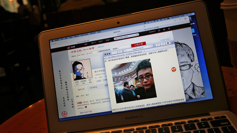 This screen shot shows Chinese Patriotic Blogger, Zhou Xiaoping's Sina Weibo account and his selfie near Chinese President Xi Jinping with officials at the Great Hall of the People, in his blog, in Beijing, China Thursday, Oct. 23, 2014. He shook hands with President Xi Jinping earlier this month in a rare literature and arts meeting, where the 33-year-old blogger sat along with Chinese novelist and Nobel literature laureate Mo Yan. Zhou said in his blog that Xi told him to keep spreading “positive energy on the Internet.” (AP Photo/Andy Wong)