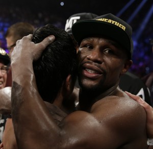 Floyd Mayweather Jr., right, hugs Manny Pacquiao after their welterweight title fight on Saturday, May 2, 2015 in Las Vegas.  AP PHOTO/ISAAC BREKKEN
