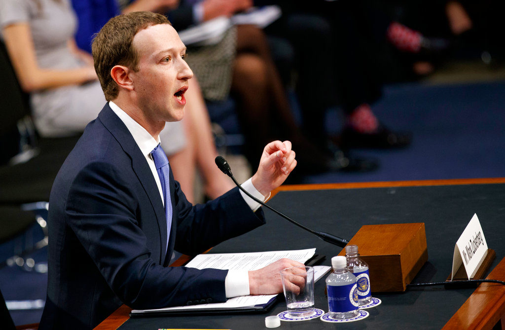 FILE- In this Tuesday, April 10, 2018, file photo, Facebook CEO Mark Zuckerberg testifies before a joint hearing of the Commerce and Judiciary Committees on Capitol Hill in Washington. Zuckerberg repeatedly assured lawmakers Tuesday and Wednesday that he didn’t believe the company violated its 2011 agreement with the Federal Trade Commission to overhaul its privacy practices. (AP Photo/Carolyn Kaster, File)