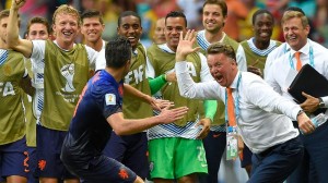Netherlands' Robin van Persie celebrates with Netherlands' head coach Louis van Gaal after scoring a goal during the group B World Cup soccer match between Spain and the Netherlands at the Arena Ponte Nova in Salvador, Brazil, Friday, June 13, 2014. AP FILE PHOTO