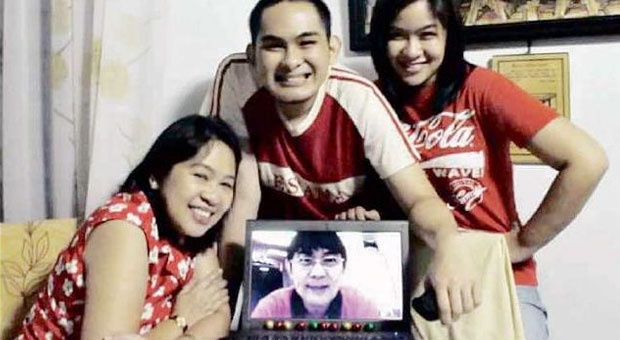ONLINEMOMENT Anne Marie Carmela Dayauon, hermother Carmen and brother Aldrin share a moment over Skype with their dad, Alvin, who is in Dubai. CARMELA DAYAUON/CONTRIBUTOR