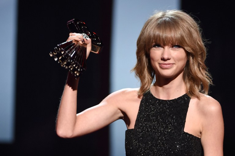Singer-songwriter Taylor Swift accepts the Best Lyrics Award for “Blank Space” during the 2015 iHeartRadio Music Awards at The Shrine Auditorium on March 29 in Los Angeles, California. Swift last year pulled her music from Spotify, urging it to provide more compensation to artists. AFP