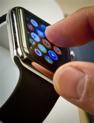  In this April 10, 2015 file photo, a customer examines Apple's new watch in New York.  AP
