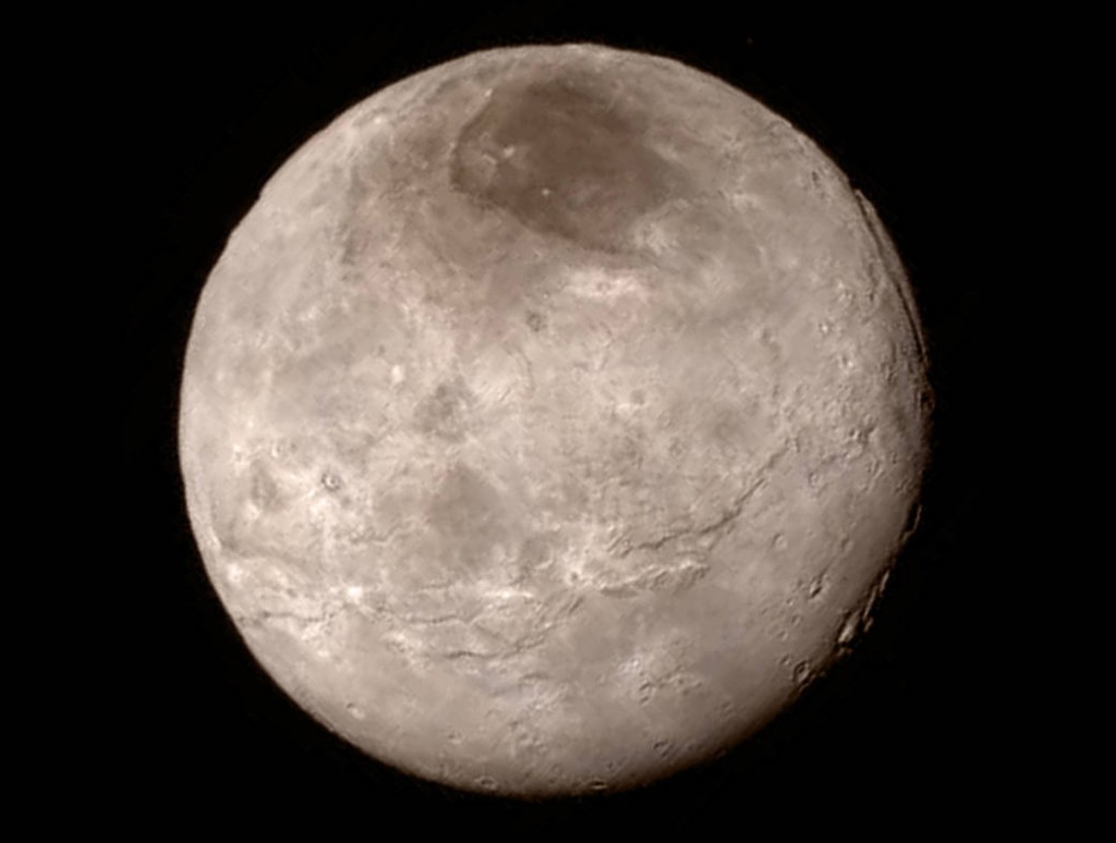 This Tuesday, July 14, 2015 image provided by NASA on Wednesday shows Pluto's largest moon, Charon, made by the New Horizons spacecraft. (NASA/JHUAPL/SwRI via AP)