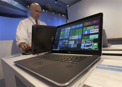 In this April 29, 2015 file photo, a Dell laptop computer running Windows 10 is on display at the Microsoft Build conference in San Francisco. Microsoft’s new Windows 10 operating system debuts Wednesday, July 29, 2015, as the longtime leader in PC software struggles to carve out a new role in a world where people increasingly rely on smartphones, tablets and information stored online. AP