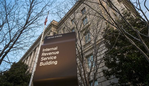 In this April 13, 2014 file photo, the Internal Revenue Service Headquarters (IRS) building is seen in Washington. The IRS says thieves used an agency website to steal tax information from as many as 220,000 additional taxpayers. The agency first disclosed the breach in May. Monday’s revelation more than doubles the total number of potential victims, to 334,000. AP