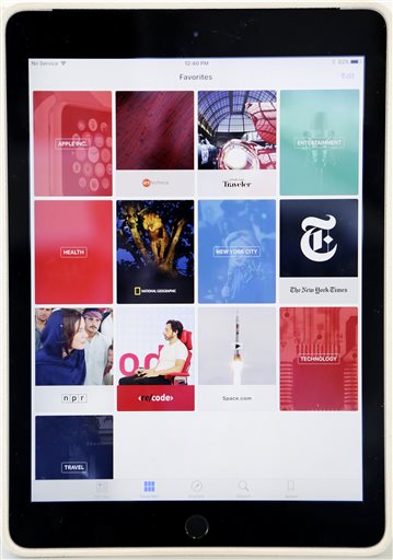 The "favorites" section of Apple's new News app is displayed on an iPad, Wednesday, Sept. 2, 2015 in New York. The tech giant will launch a news service for iPhones and iPads this month featuring partnerships with more than 50 companies so far, including CNN and National Geographic. That means millions of devices will get the app on the home screen, with no separate download required. (AP Photo/Mark Lennihan)
