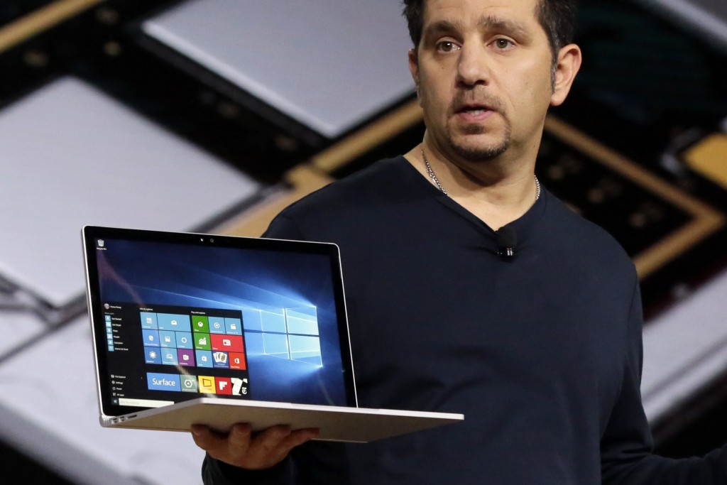 Microsoft vice president for Surface Computing Panos Panay holds a Surface Book laptop during a presentation, in New York, Tuesday, Oct. 6, 2015. Microsoft says it's for scientists, engineers and gamers who need a lot more performance than a tablet. (AP Photo/Richard Drew)