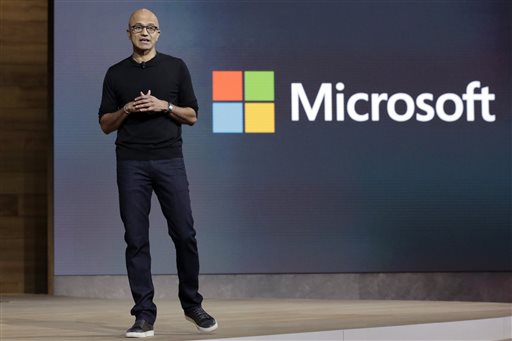 In this Oct. 6, 2015 file photo, Microsoft CEO Satya Nadella closes a presentation of new devices in New York. Microsoft reports quarterly financial results Thursday, Oct. 22, 2015. AP FILE PHOTO