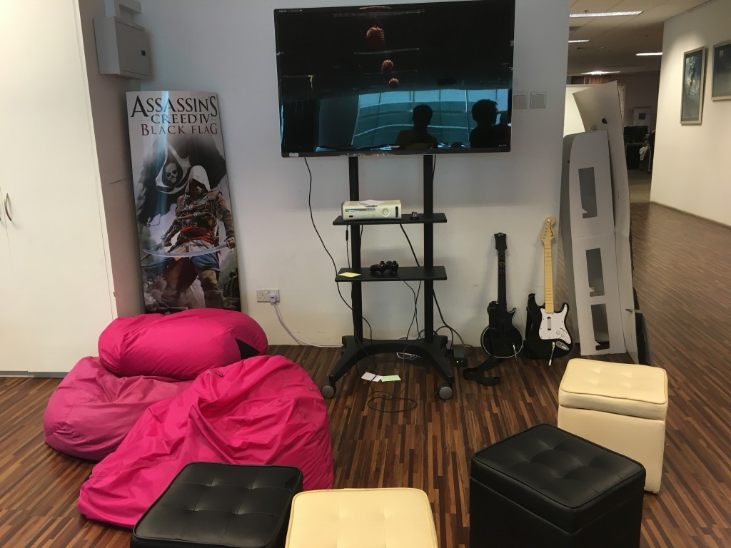 Corner where workers and guests can play video games during their free time, including the popular Rock Band