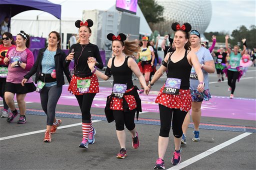 This undated photo provided by Walt Disney World shows costumed runners participating in a race at the theme park in Lake Buena Vista, Florida. Many runners dress up for the popular half-marathons at Disney, where photo ops with costumed characters are as important as race times. (Disney via AP)