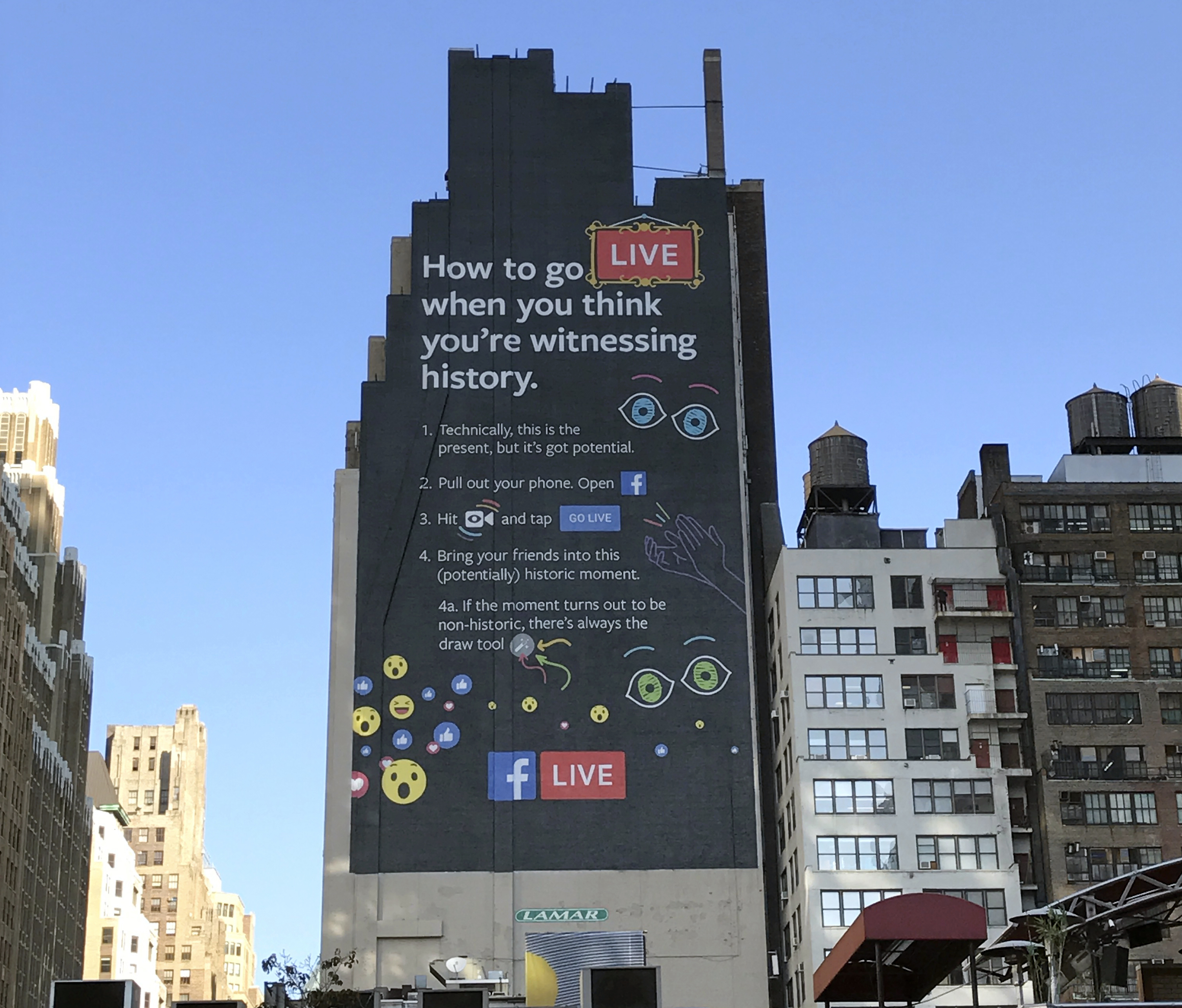 This Nov. 16, 2016, photo shows a Facebook Live billboard on the side of a building near New York's Penn Station. From billboards to TV ads to endless notifications, Facebook is furiously promoting its live video feature as it tries to get more users to shoot and watch such videos. (AP Photo/Anick Jesdanun)