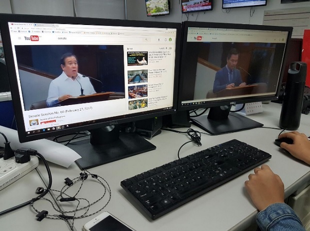 A member of the media reviews video of recent sessions of the Senate of the Philippines in this photo taken Feb. 28, 2017. YouTube says it has reached a milestone with about one-billion hours of video watched daily all over the world. INQUIRER.NET