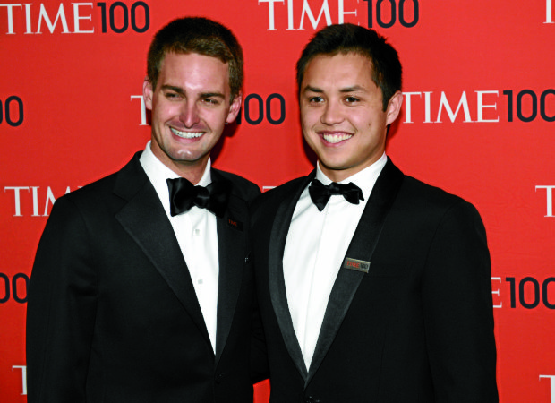 Snapchat cofounders Evan Spiegel (left) and Filipino-American RobertMurphy. —AFP