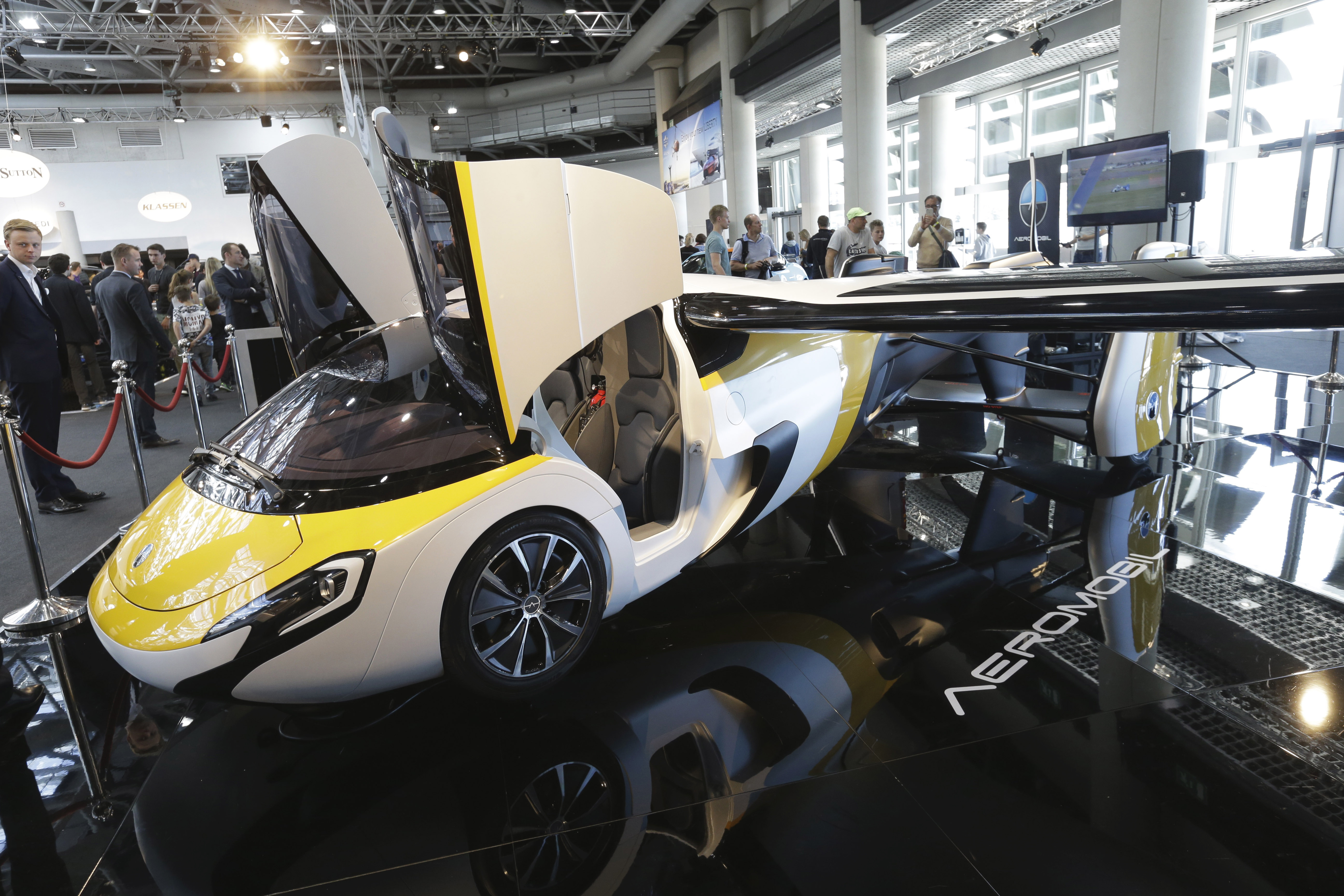 AeroMobil display their latest prototype of a flying car, in Monaco, Thursday, April 20, 2017. The light frame plane whose wings can fold back, like an insect is boosted by a rear propeller. The company says it is planning to accept first preorders for the vehicle as soon as later this year. (AP Photo/Claude Paris)