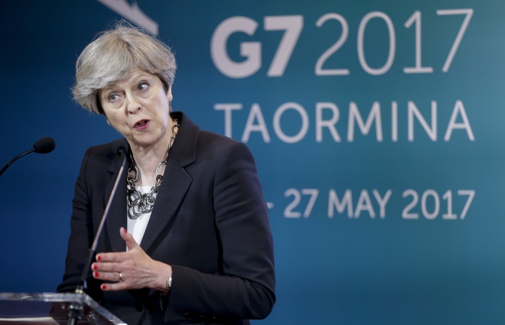 British Prime Minister Theresa May speaks during a news conference in the Sicilian town of Taormina, Italy, Friday May 26, 2017. Leaders of the G7 meet Friday and Saturday, including newcomers Emmanuel Macron of France and Theresa May of Britain in an effort to forge a new dynamic after a year of global political turmoil amid a rise in nationalism. (AP Photo/Luca Bruno)