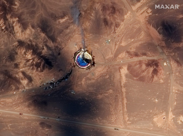 Satellite photos show burning Iran space center launch pad