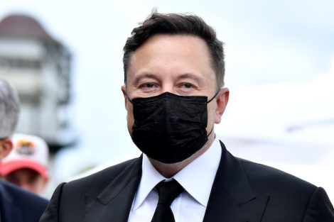 Elon Musk wears a protective mask as he arrives to attend a meeting with the leadership of the conservative CDU/CSU parliamentary group, in Berlin