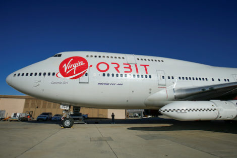 Richard Branson's Virgin Orbit, with a rocket underneath the wing of a modified Boeing 747 jetliner, prior to its takeoff on a key drop test of its high-altitude launch system for satellites from Mojave, California