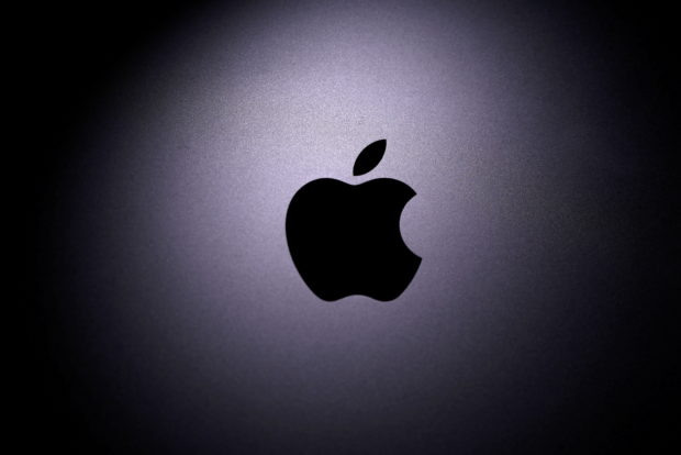 The Apple logo is seen on a Macbook in this illustration photo taken April 12, 2020. REUTERS/Dado Ruvic/Illustration/File Photo