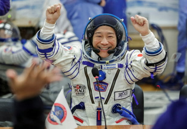 FILE PHOTO: Japanese entrepreneur Yusaku Maezawa reacts as he speaks with his family after donning space suits shortly before the launch to the International Space Station (ISS) at the Baikonur Cosmodrome, Kazakhstan, December 8, 2021.  REUTERS/Shamil Zhumatov/File Photo
