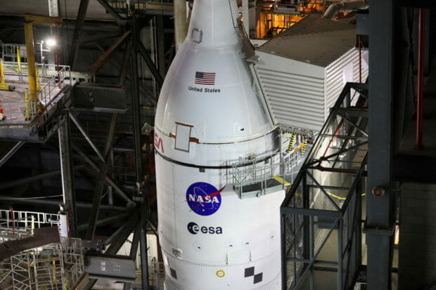 NASA's next-generation moon rocket, the Space Launch System (SLS) rocket with its Orion crew capsule perched on top, is seen in the Vehicle Assembly Building (VAB) before it is scheduled to make a slow-motion journey to its launch pad at Cape Canaveral, Florida, U.S. March 16, 2022. REUTERS/Thom Baur