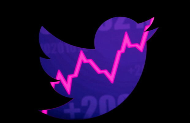 FILE PHOTO: Illustration shows Twitter logo and a rising stock graph in this illustration taken, April 25, 2022. REUTERS/Dado Ruvic/Illustration