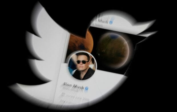 Elon Musk's Twitter account is seen through the Twitter logo in this illustration taken April 25, 2022. REUTERS/Dado Ruvic/Illustration
