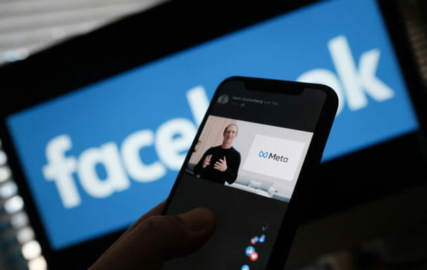 Smartphone showing Mark Zuckerberg over Facebook logo.  STORY: Facebook parent firm to launch 'metaverse academy' in France