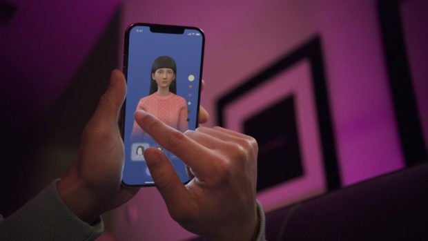 FILE PHOTO: A user interacts with a smartphone app to customize an avatar for a personal artificial intelligence chatbot, known as a Replika, in San Francisco