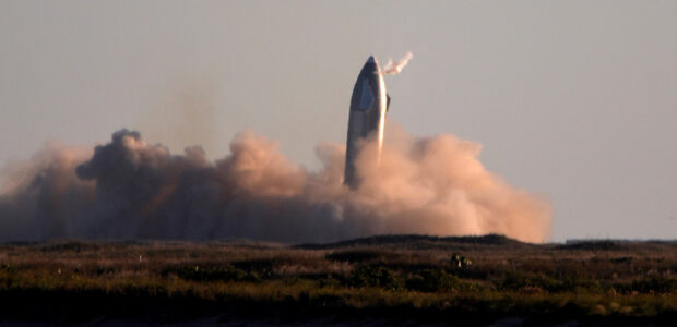 FILE PHOTO: SpaceX's first super heavy-lift Starship SN8 rocket during a return-landing attempt after it launched from their facility on a test flight in Boca Chica, Texas